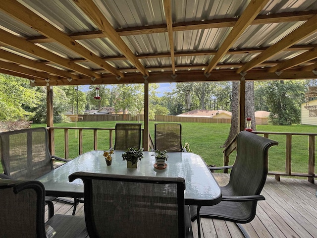 wooden terrace featuring a yard