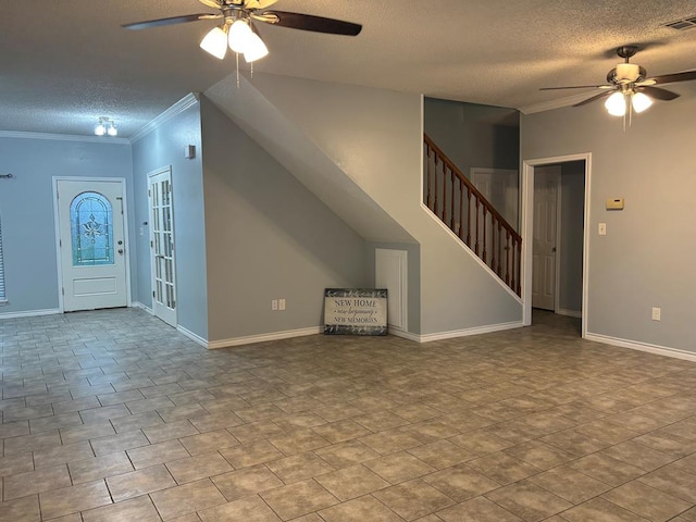 interior space featuring visible vents, ceiling fan, stairway, ornamental molding, and a textured ceiling