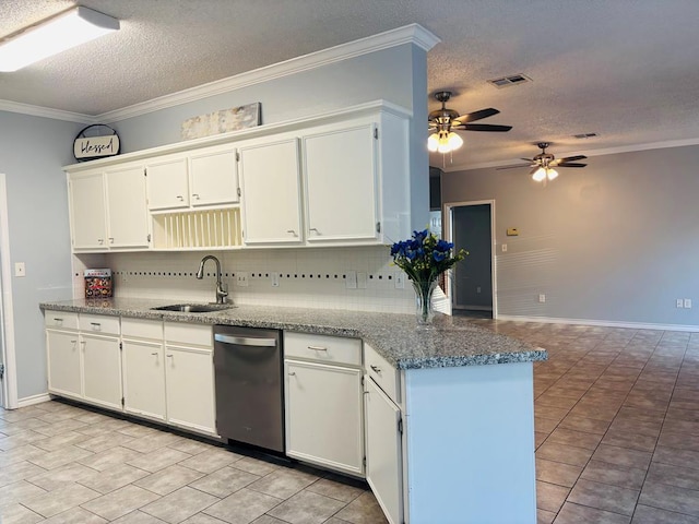 kitchen featuring white cabinets, a sink, visible vents, and crown molding