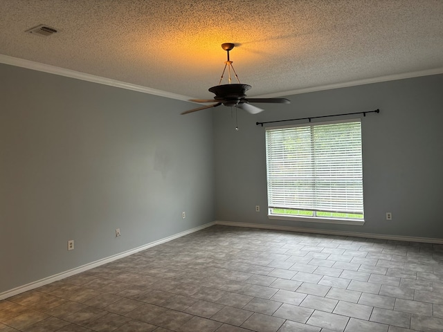 empty room with visible vents, crown molding, a textured ceiling, and ceiling fan