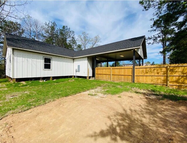 rear view of house with fence