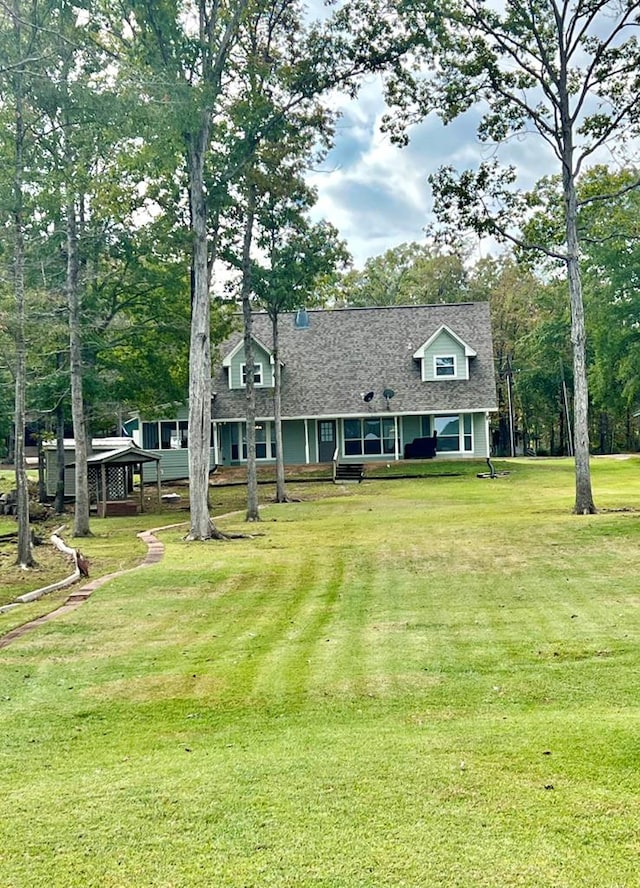 419 Pinemont Dr, Hemphill, TX 75948 - view of front facade featuring a front yard and a shingled roof