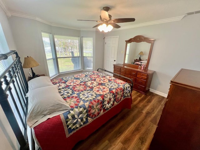 bedroom with ornamental molding, ceiling fan, and dark wood-type flooring