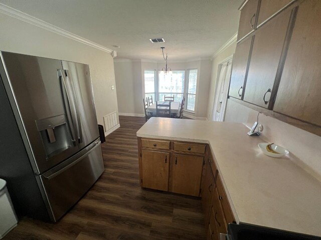 kitchen featuring stainless steel refrigerator with ice dispenser, ornamental molding, dark hardwood / wood-style flooring, kitchen peninsula, and a chandelier