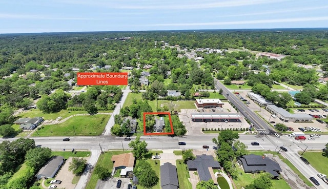 618 Frank St, Lufkin, TX 75904 - aerial view of property's location featuring a heavily wooded area and property boundaries highlighted