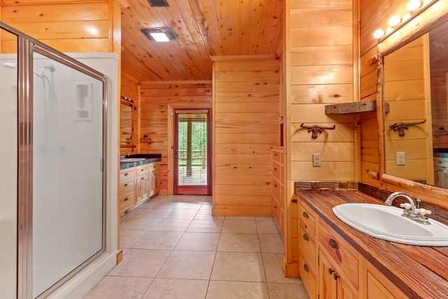 bathroom featuring tile patterned floors, an enclosed shower, vanity, wooden walls, and wooden ceiling