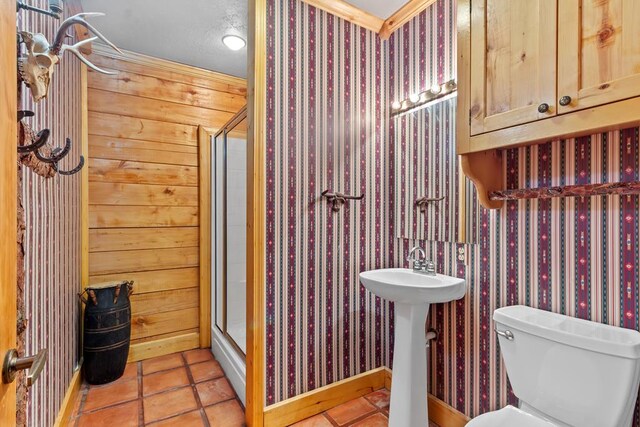194 Woodsedge Dr, Brookeland, TX 75931 - full bathroom featuring a stall shower, wallpapered walls, and tile patterned flooring