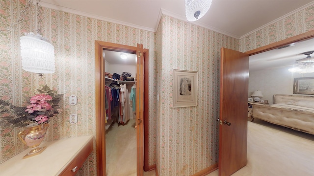 hallway with light carpet and crown molding