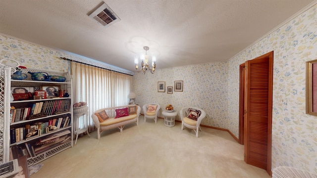 living area featuring carpet floors, a chandelier, a textured ceiling, and ornamental molding