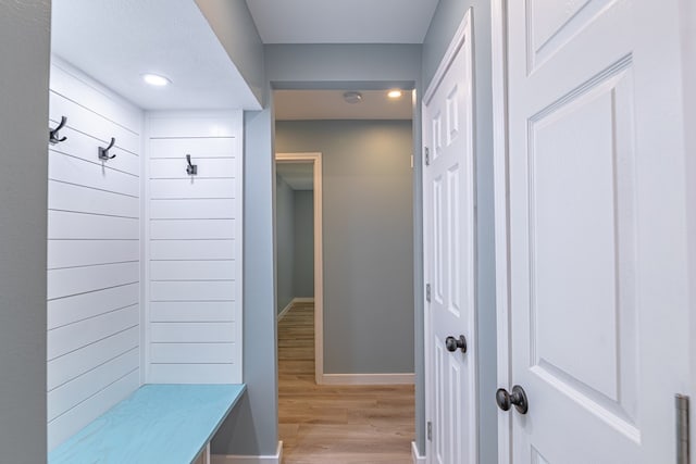 mudroom featuring light wood-type flooring, baseboards, and recessed lighting