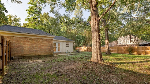 view of yard with french doors