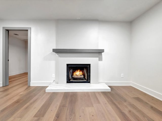 interior details featuring hardwood / wood-style flooring