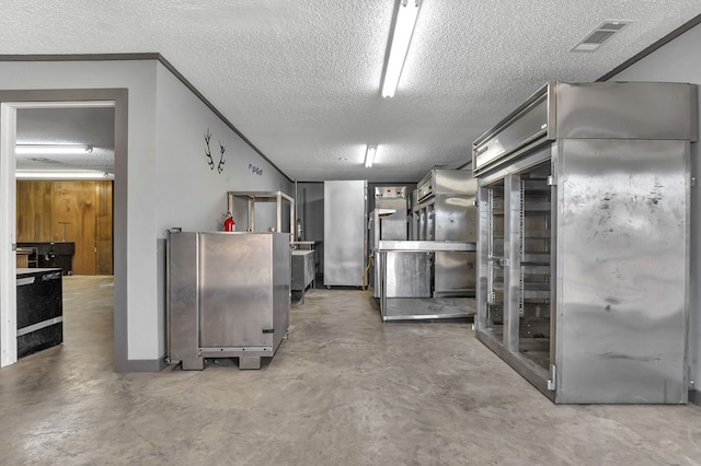 basement featuring a textured ceiling