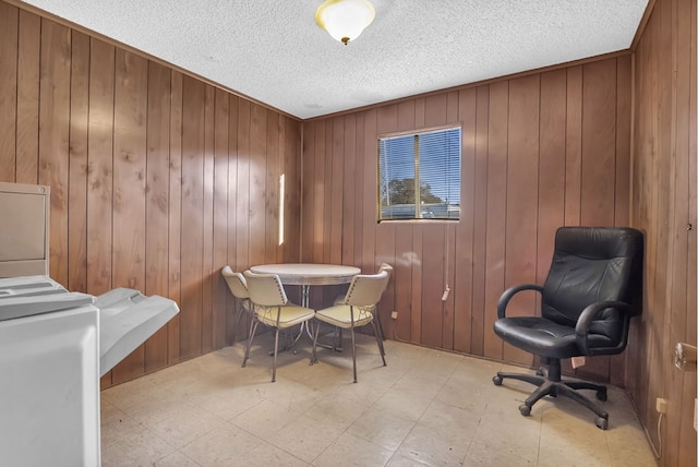 dining room featuring wooden walls