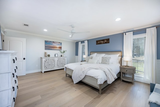 bedroom with crown molding, light hardwood / wood-style floors, and ceiling fan