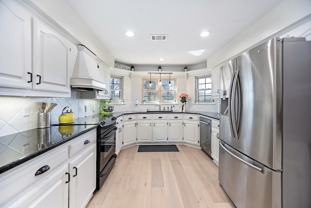 dining space with crown molding and light wood-type flooring