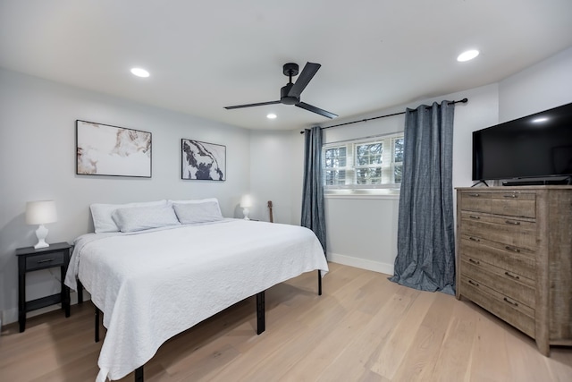 bedroom featuring ceiling fan and light hardwood / wood-style floors