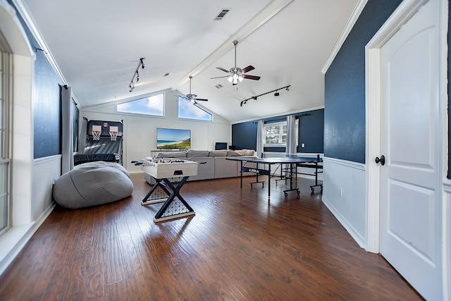 living room with crown molding, lofted ceiling with beams, track lighting, hardwood / wood-style flooring, and ceiling fan