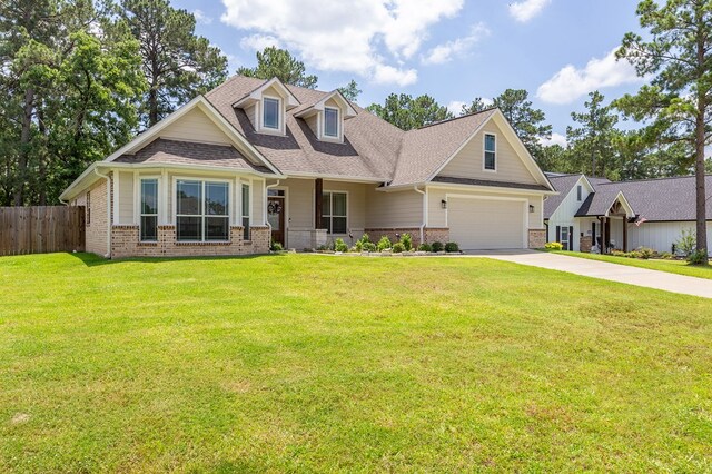 181 Rustic Pines Dr, Lufkin, TX 75904 - view of front facade with brick siding, driveway, and roof with shingles
