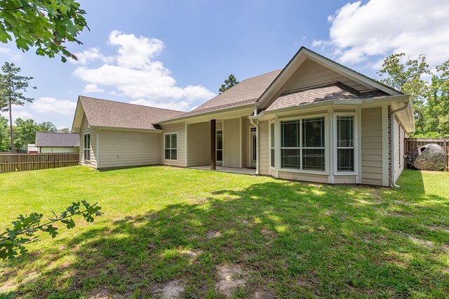 181 Rustic Pines Dr, Lufkin, TX 75904 - rear view of house with a patio and roof with shingles