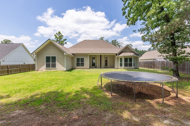 181 Rustic Pines Dr, Lufkin, TX 75904 - rear view of house featuring a trampoline