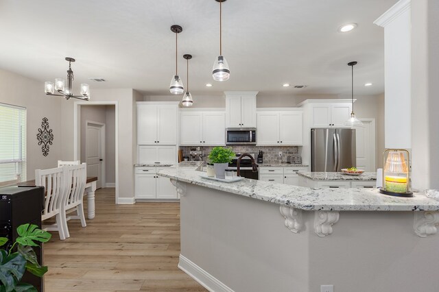 181 Rustic Pines Dr, Lufkin, TX 75904 - kitchen featuring stainless steel appliances, tasteful backsplash, light wood-style floors, recessed lighting, and baseboards