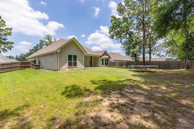 181 Rustic Pines Dr, Lufkin, TX 75904 - back of property featuring a trampoline and cooling unit