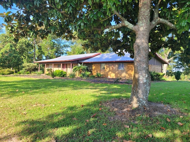 339 Liles Ln, Hudson, TX 75904 - ranch-style house featuring a front lawn and metal roof