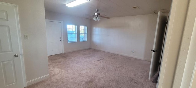 empty room with ceiling fan and light colored carpet