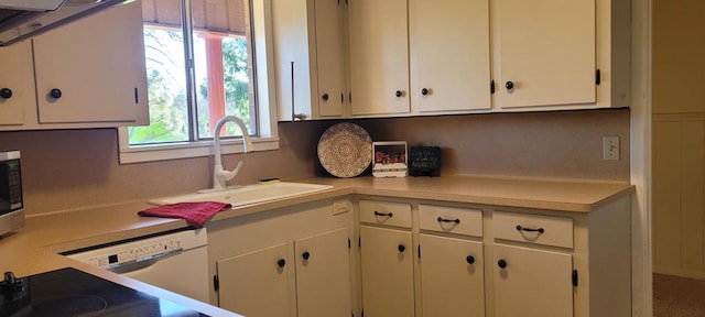 339 Liles Ln, Hudson, TX 75904 - kitchen featuring a sink, light countertops, white cabinetry, and stainless steel microwave