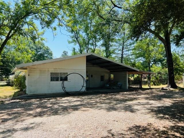 view of property exterior featuring a carport