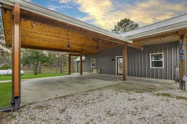 exterior space featuring gravel driveway and an attached carport