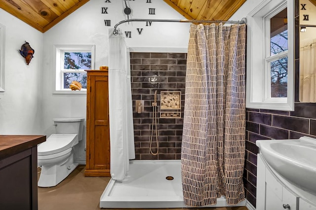 bathroom featuring lofted ceiling, toilet, wood ceiling, vanity, and a stall shower