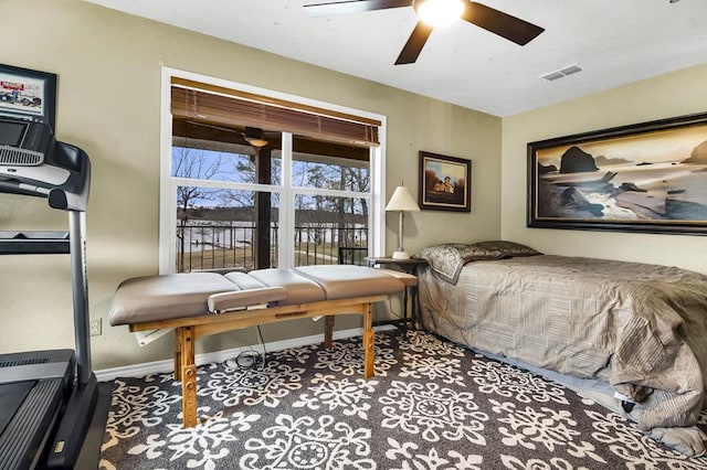 bedroom featuring ceiling fan, visible vents, and baseboards