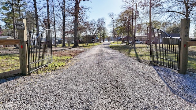 view of street featuring a gate and a gated entry