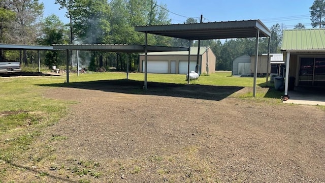 view of parking with a yard, a garage, and a carport