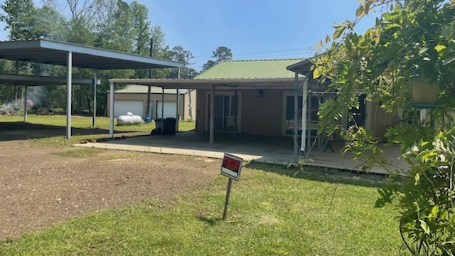 exterior space with a carport