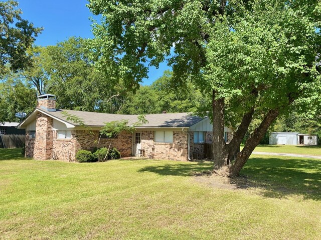 3759 Bethlehem Rd, Lufkin, TX 75904 - view of front of house with brick siding and a chimney