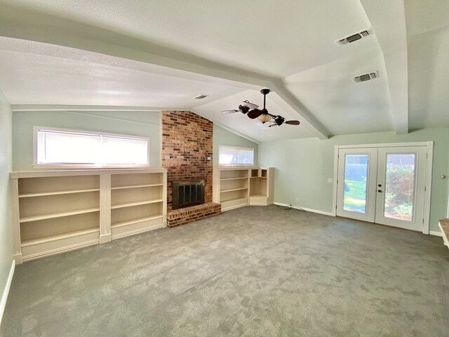 3759 Bethlehem Rd, Lufkin, TX 75904 - unfurnished living room featuring lofted ceiling, carpet floors, a fireplace, french doors, and a ceiling fan