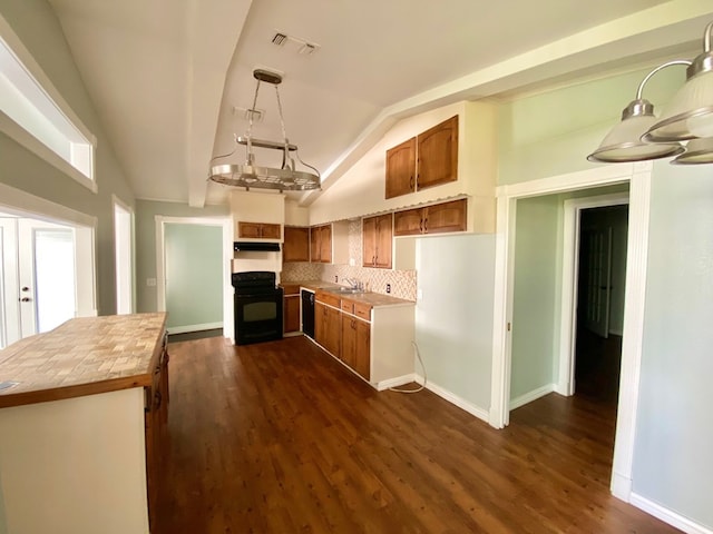 3759 Bethlehem Rd, Lufkin, TX 75904 - kitchen featuring range, black dishwasher, a sink, butcher block counters, and under cabinet range hood