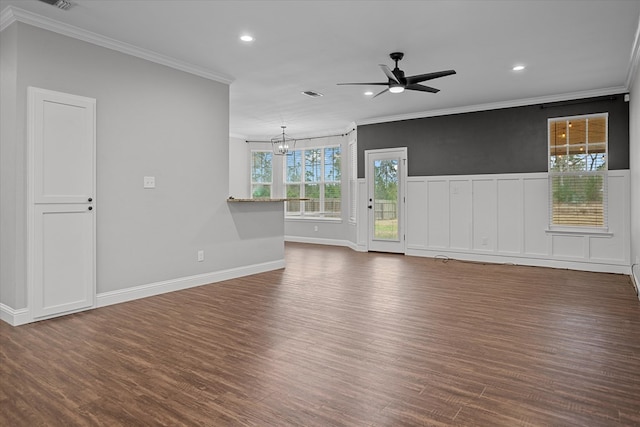 interior space with visible vents, dark wood finished floors, crown molding, and ceiling fan with notable chandelier