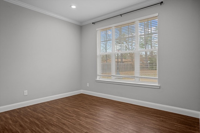 empty room with recessed lighting, baseboards, dark wood-style flooring, and crown molding