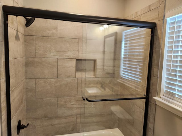 full bathroom featuring a bath and an enclosed shower