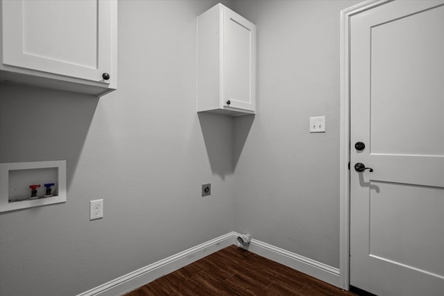 laundry room featuring electric dryer hookup, dark wood-type flooring, cabinet space, baseboards, and hookup for a washing machine