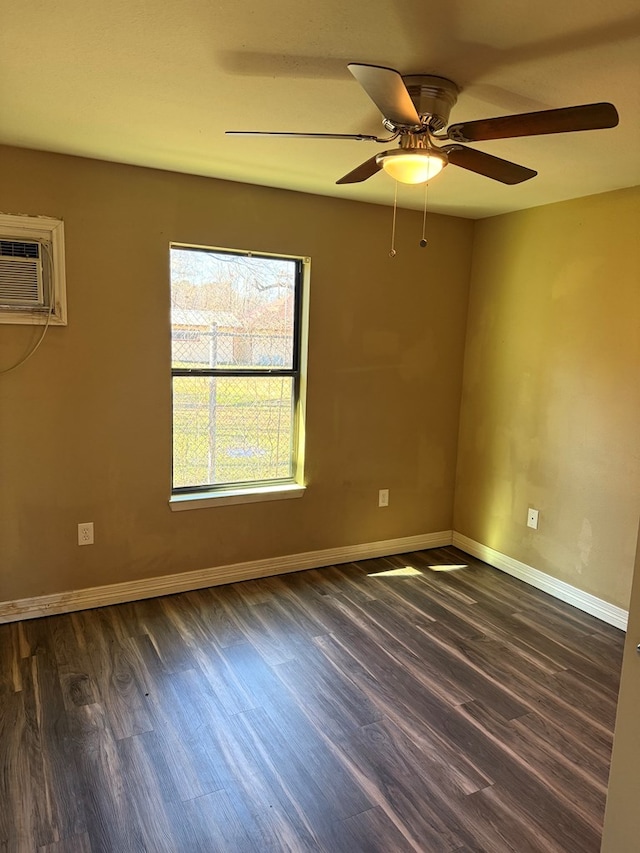 unfurnished room with ceiling fan, dark wood-type flooring, and a wall unit AC