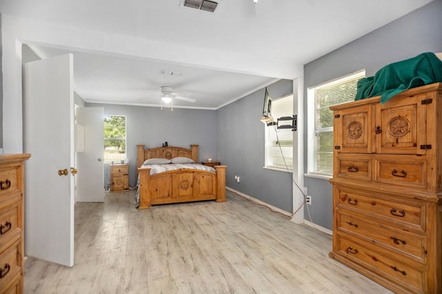 277 Mcclendon Rd, Lufkin, TX 75904 - bedroom featuring light wood-type flooring, ornamental molding, and a ceiling fan