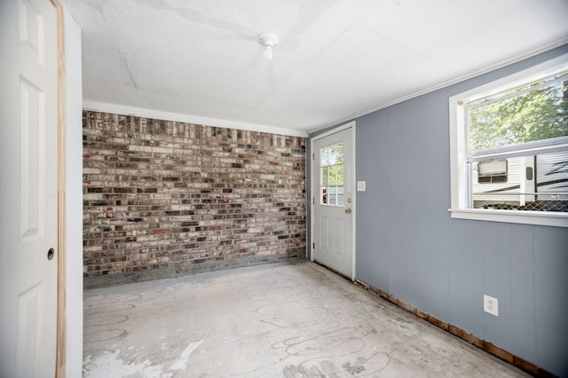 277 Mcclendon Rd, Lufkin, TX 75904 - empty room with brick wall