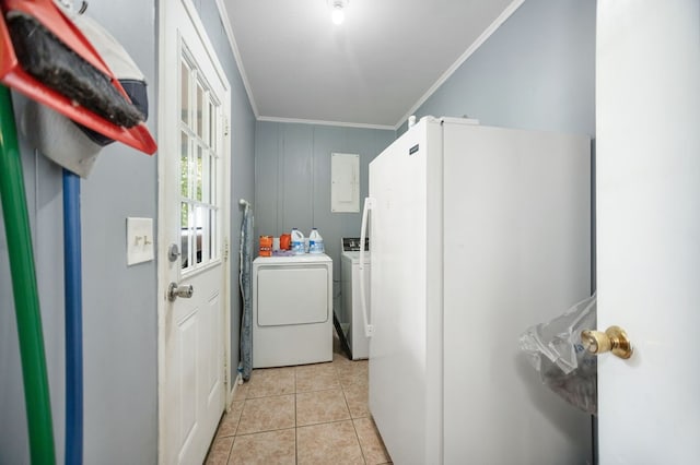 277 Mcclendon Rd, Lufkin, TX 75904 - laundry area featuring washing machine and dryer, ornamental molding, and light tile patterned floors