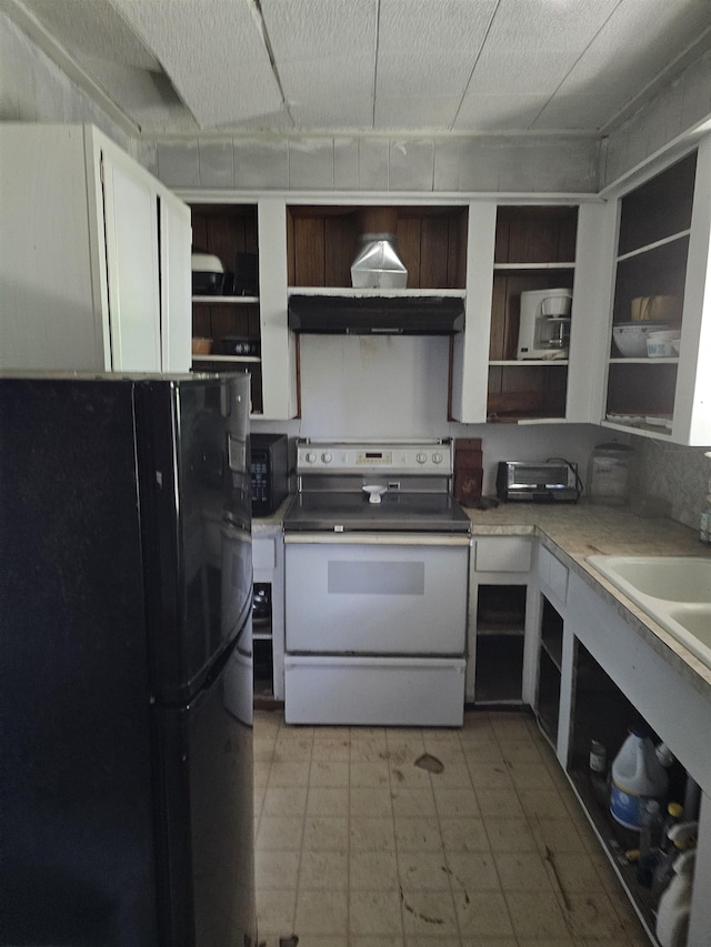 kitchen with ventilation hood and black appliances