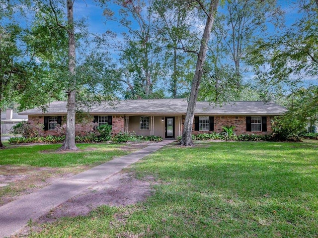 ranch-style house with a front lawn